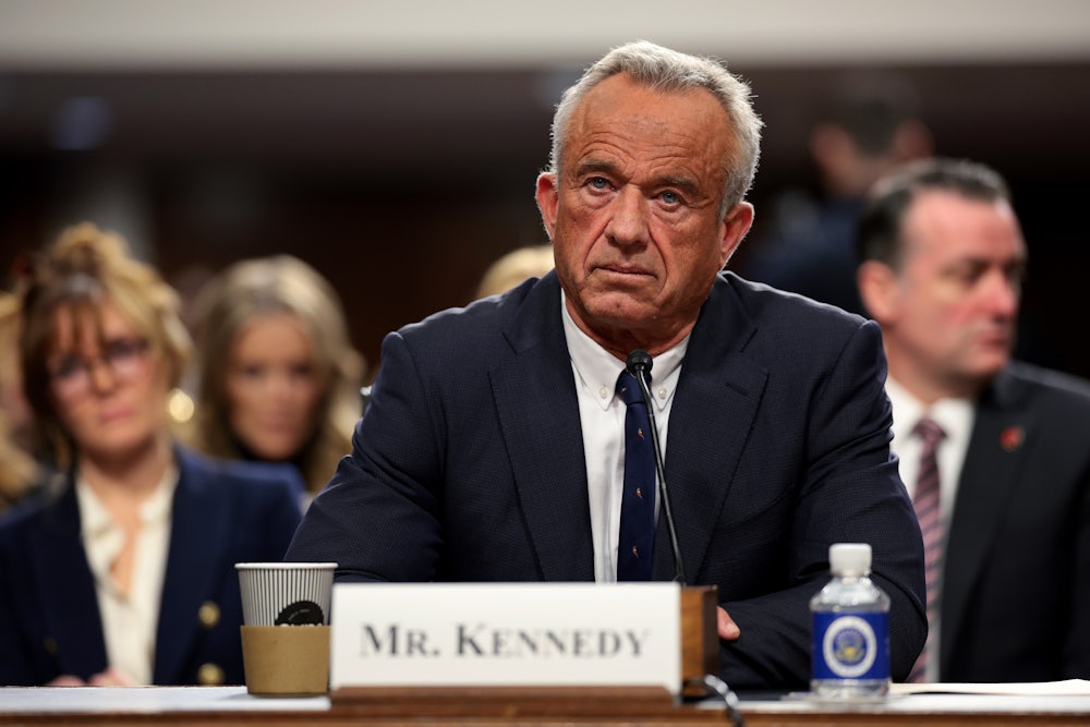 Robert F. Kennedy Jr stares forward as he sits in the Capitol for hearings over his nomination to lead the Department of Health and Human Services