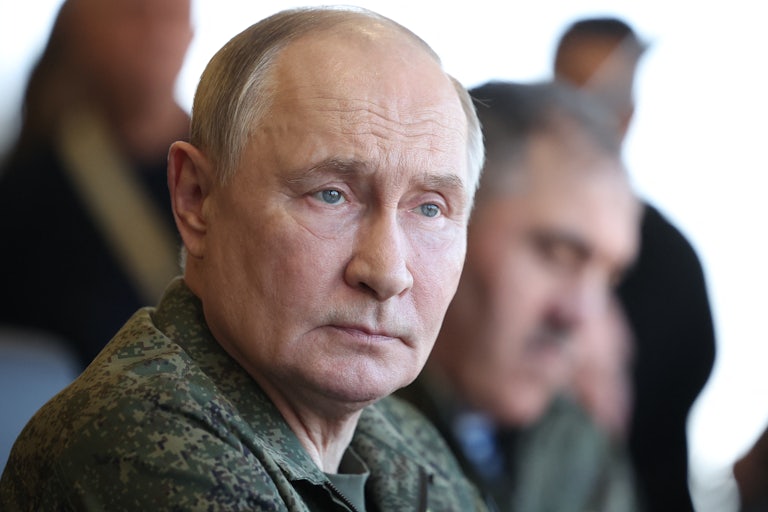 Vladimir Putin wears military fatigues