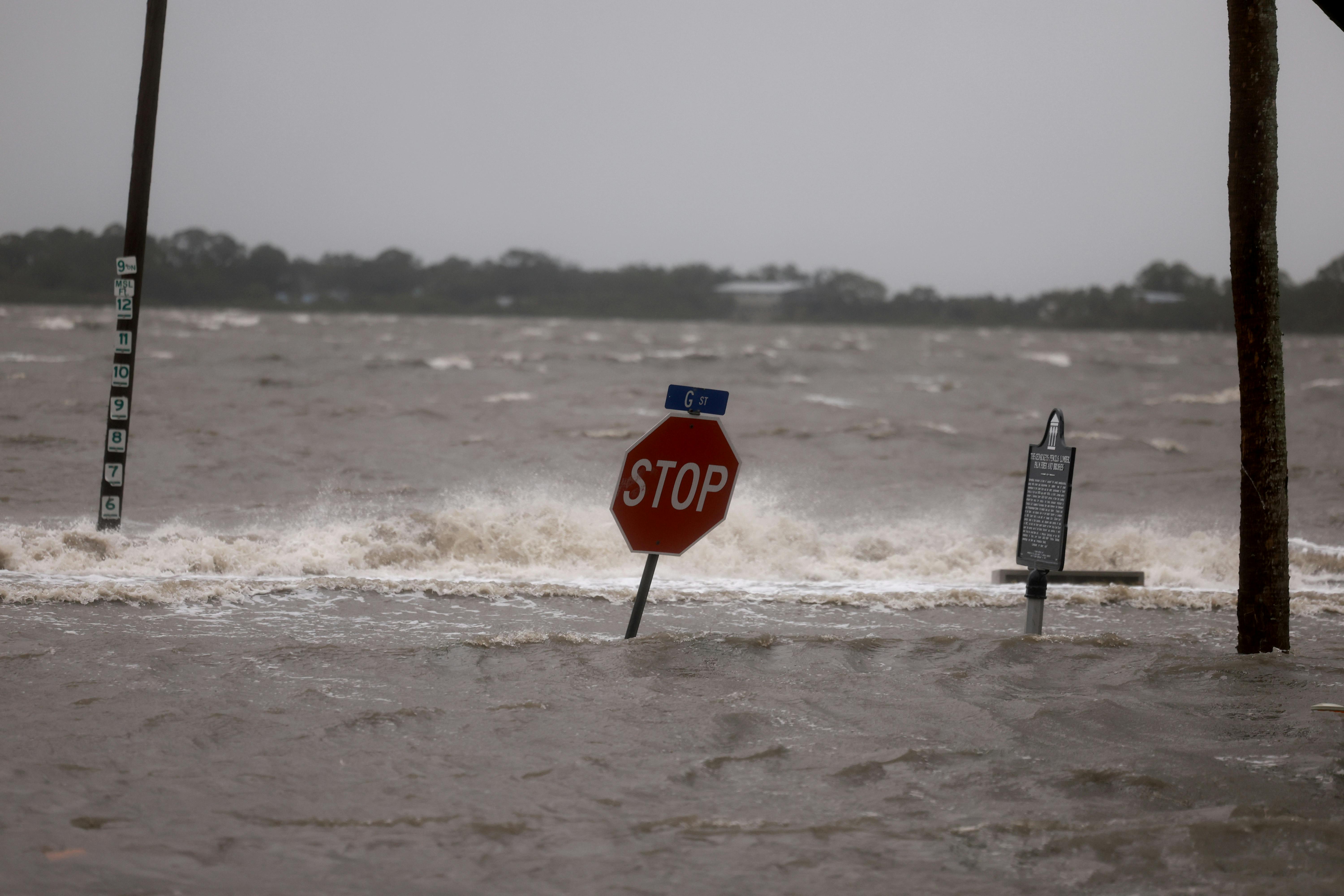 High winds, rain and storm surge from Hurricane Debby inundate a Cedar Key, Florida neighorhood.
