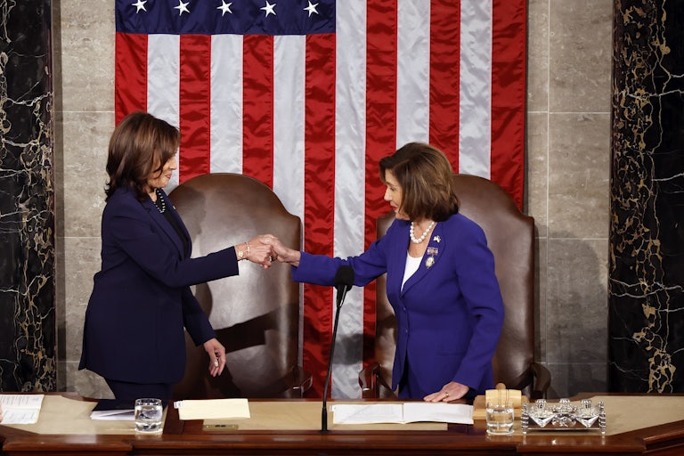 Kamala Harris and Nancy Pelosi shake hands in Congress