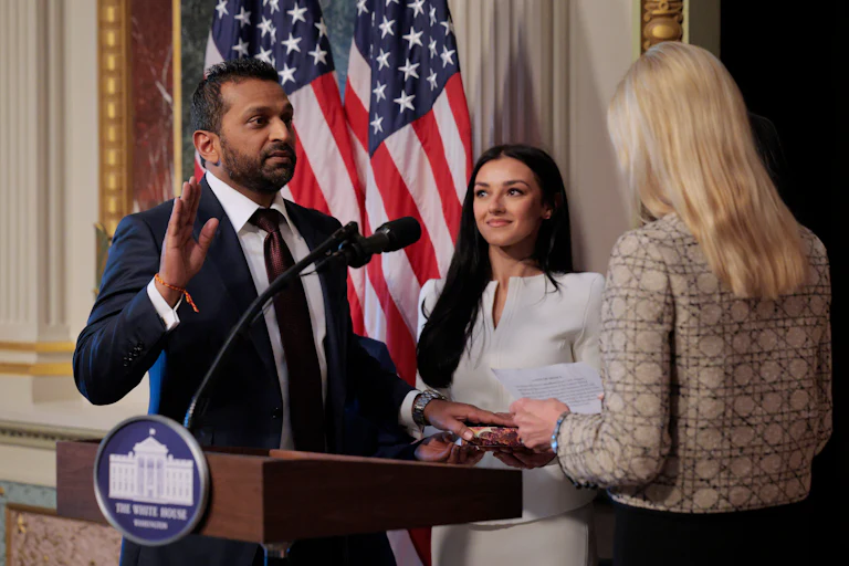 Attorney General Pam Bondi swears in FBI Director Kash Patel as his girlfriend Alexis Wilkins holds the Bhagavad Gita