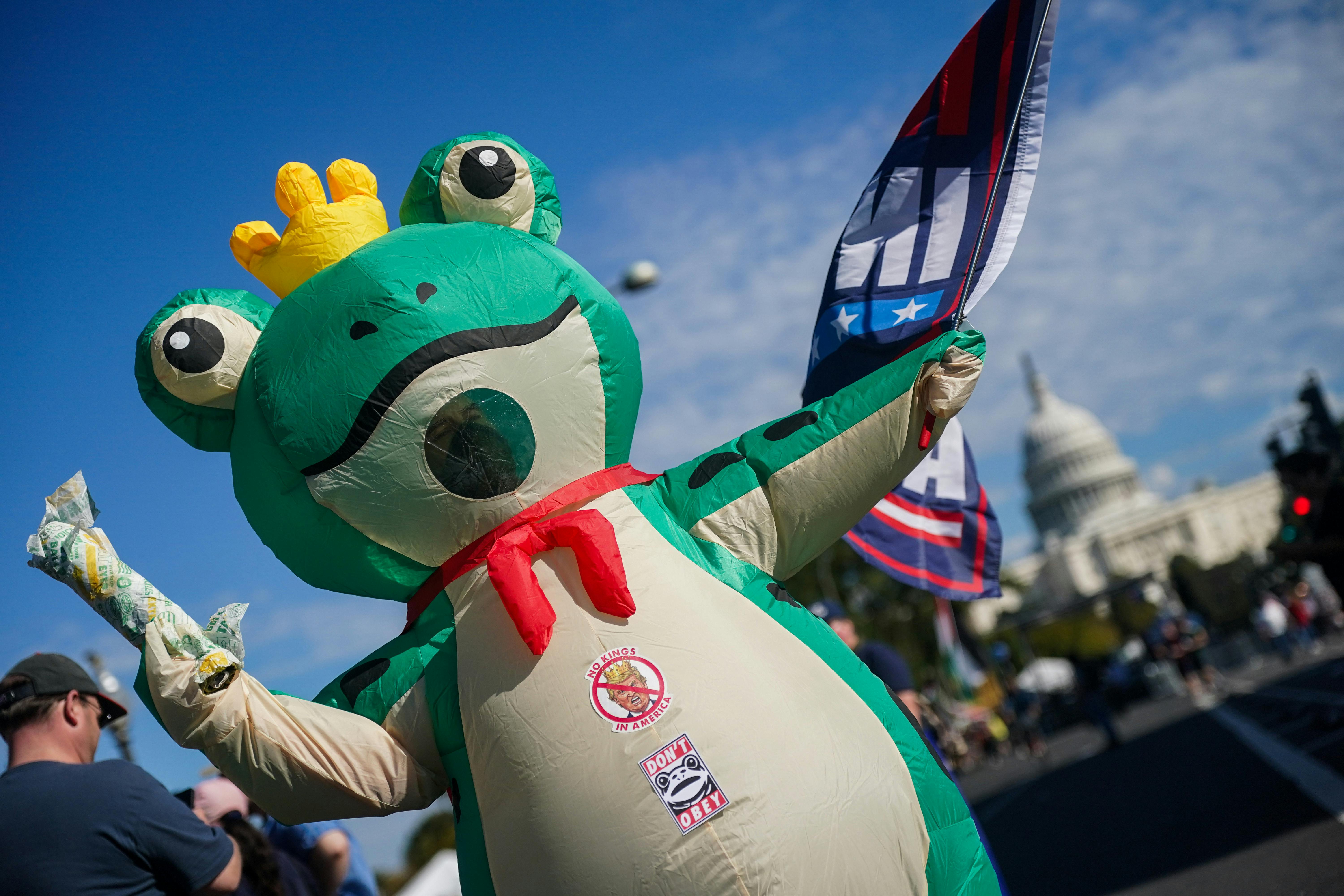 A person wears an inflatable frog costume at an anti-Trump protest in Portland, Oregon
