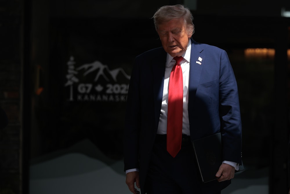 Donald Trump walks out to talk to reporters after signing a trade agreement with British Prime Minister Keir Starmer.