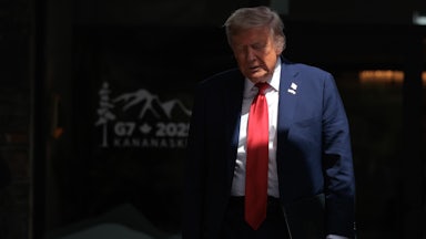 Donald Trump walks out to talk to reporters after signing a trade agreement with British Prime Minister Keir Starmer.