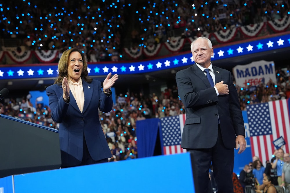 Kamala Harris and Tim Walz appear on stage together during a campaign event at the Liacouras Center at Temple University in Philadelphia, Pennsylvania.