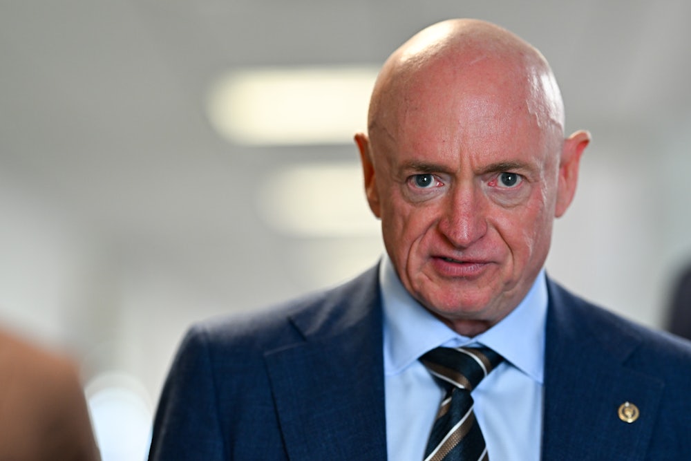 Senator Mark Kelly stares into camera