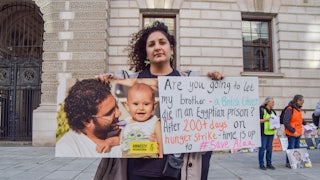 Sanaa Seif holds a picture of her brother Alaa Abdel Fattah