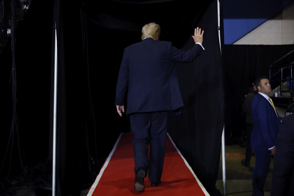 Donald Trump walks off stage at the conclusion of a campaign rally at the Salem Civic Center.