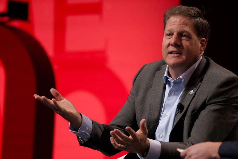 Chris Sununu gestures while speaking