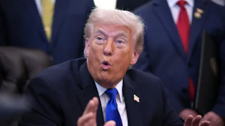 Donald Trump gestures while speaking