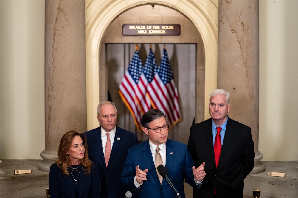 House Speaker Mike Johnson and other House Republicans speak during a news conference at the U.S. Capitol on October 2.