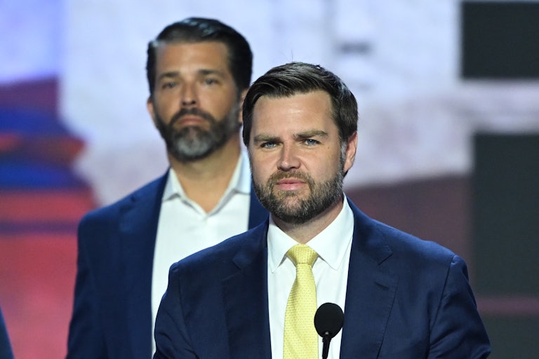 Donald Trump, Jr. stands behind J.D. Vance during the Republican National Convention