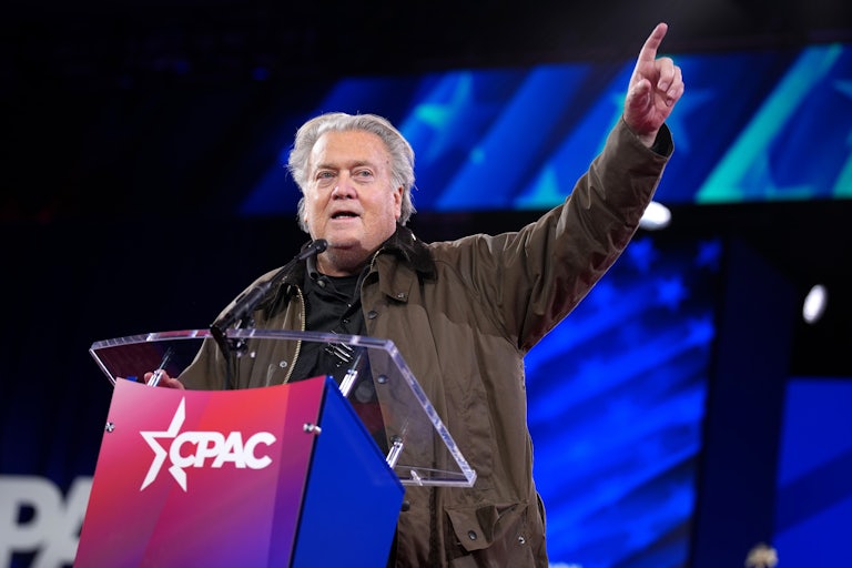 Steve Bannon raises his finger as he speaks on stage at CPAC