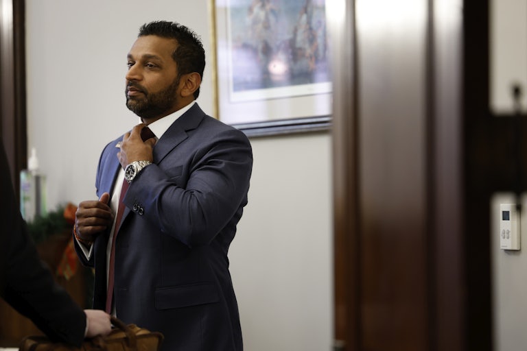 Kash Patel adjusts his tie