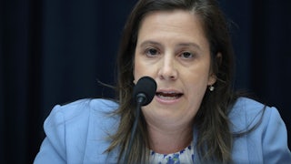 Representative Elise Stefanik speaks into a microphone
