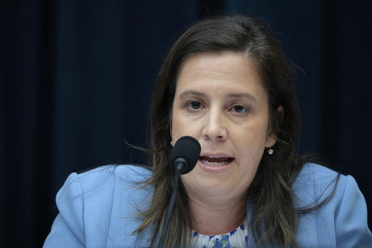 Representative Elise Stefanik speaks into a microphone