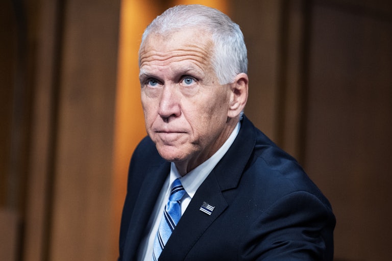 Senator Thom Tillis leans forward and looks up