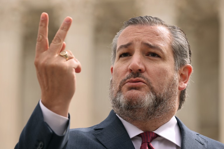 A close-up of Senator Ted Cruz gesturing with two fingers.