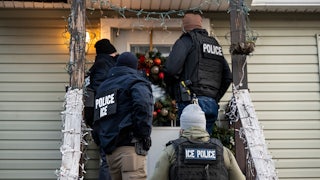 U.S. Immigration and Customs Enforcement (ICE) agents knock on the door of a residence during a multi-agency targeted enforcement operation in Chicago, Illinois, US, on Sunday, Jan. 26, 2025.