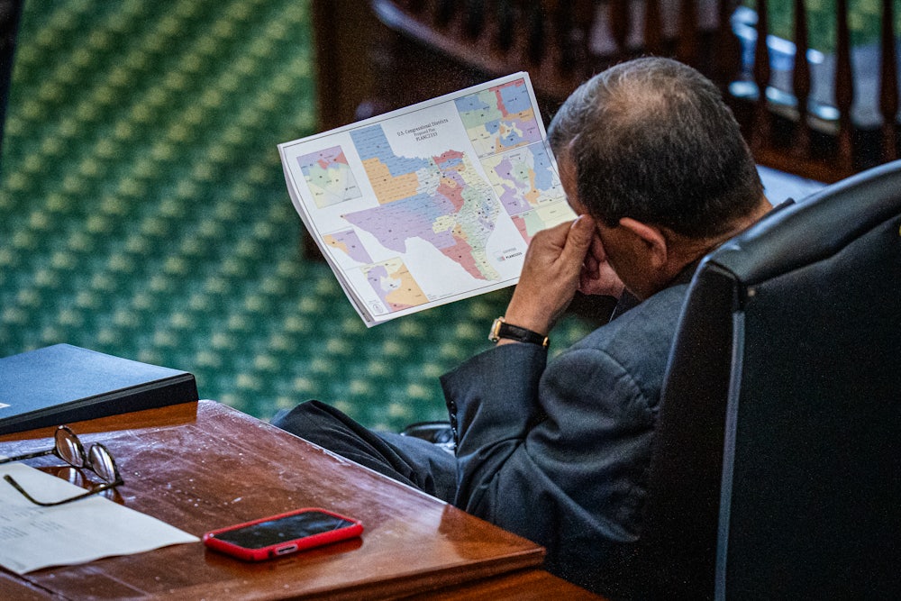 Texas Sen. Pete Flores looks at the proposed redistricting map.