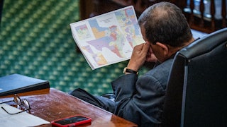 Texas Sen. Pete Flores looks at the proposed redistricting map.