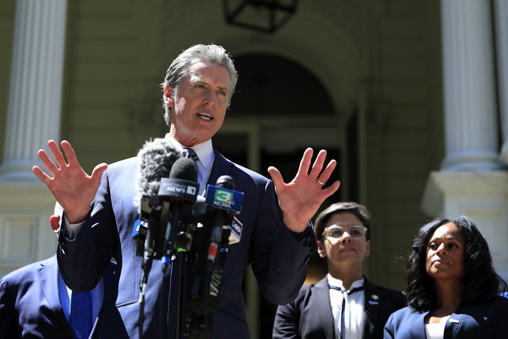 California Gov. Gavin Newsom speaks during a news conference with Texas lawmakers