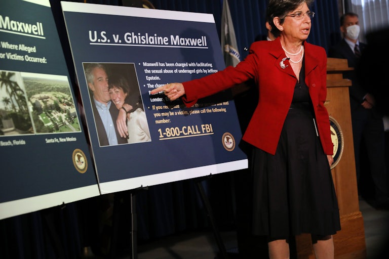 Acting U.S. Attorney for the Southern District of New York Audrey Strauss points to a photo of Ghislaine Maxwell and Jeffrey Epstein