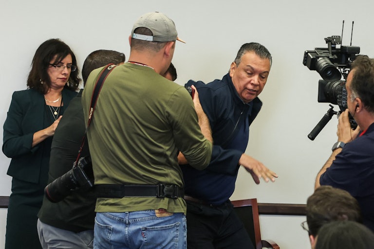 Senator Alex Padilla being forced out of Homeland Security Secretary Kristi Noem's press conference.
