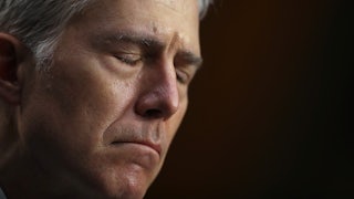 A close-up of a frowning Justice Neil Gorsuch