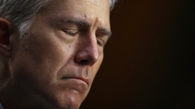 A close-up of a frowning Justice Neil Gorsuch