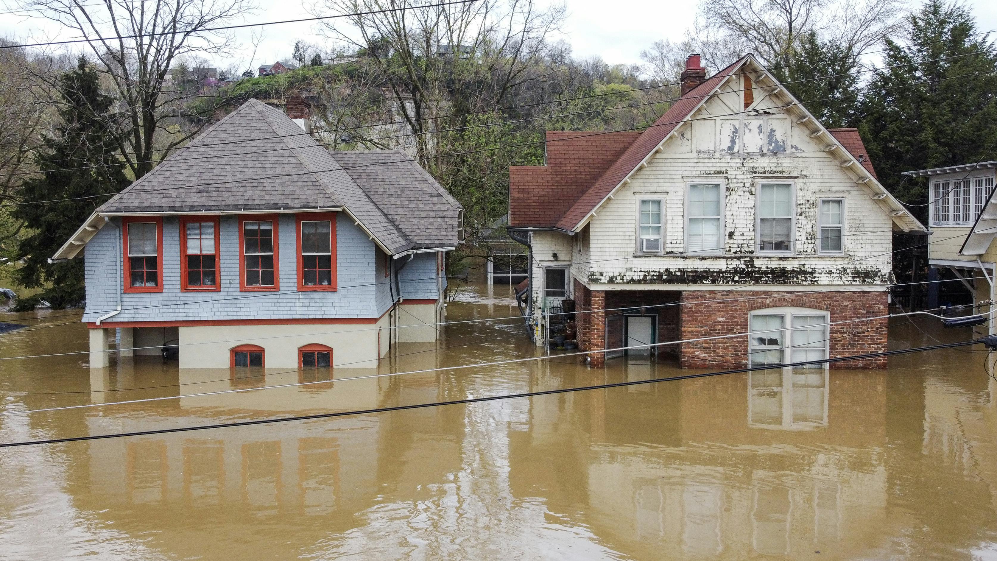 Two half-submerged houses in Frankfort, Kentucky, which was flooded by days of rain in early April
