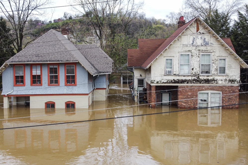 Two half-submerged houses in Frankfort, Kentucky, which was flooded by days of rain in early April