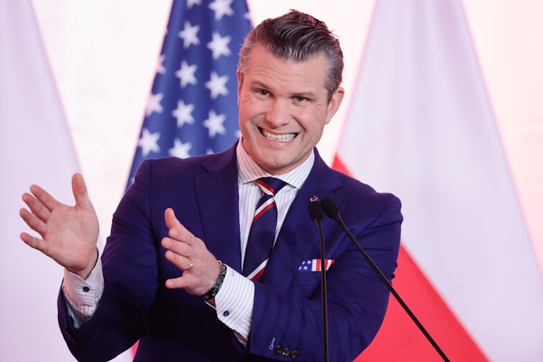 Defense Secretary Pete Hegseth gestures while speaking during a press conference