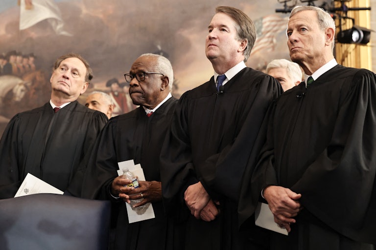 US Associate Supreme Court Justices Samuel Alito, Jr., Clarence Thomas and Brett Kavanaugh and U.S. Supreme Court Chief Justice John Roberts look on during inauguration ceremonies in the Rotunda of the U.S. Capitol.