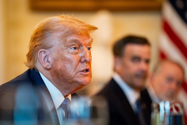 Donald Trump sits at a dinner at the White House with Israeli Prime Minster Benjamin Netanyahu