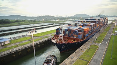 A cargo ship transits through the Panama Canal.