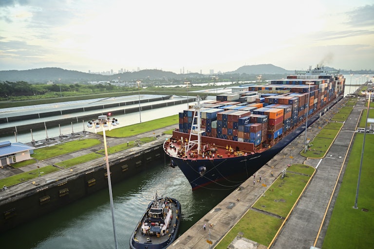A cargo ship transits through the Panama Canal.