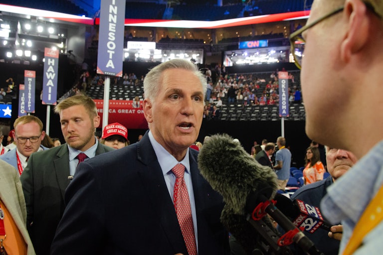 Kevin McCarthy speaks to a reporter on the House floor