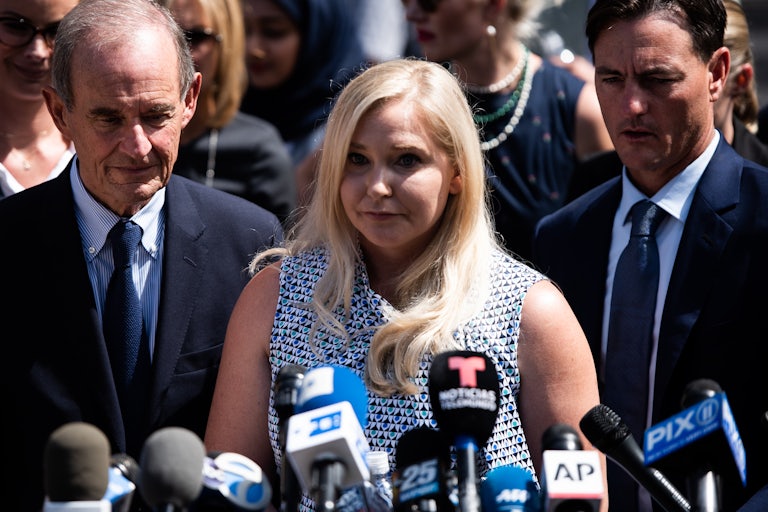 Virginia Giuffre speaks into microphones outside a New York courthouse