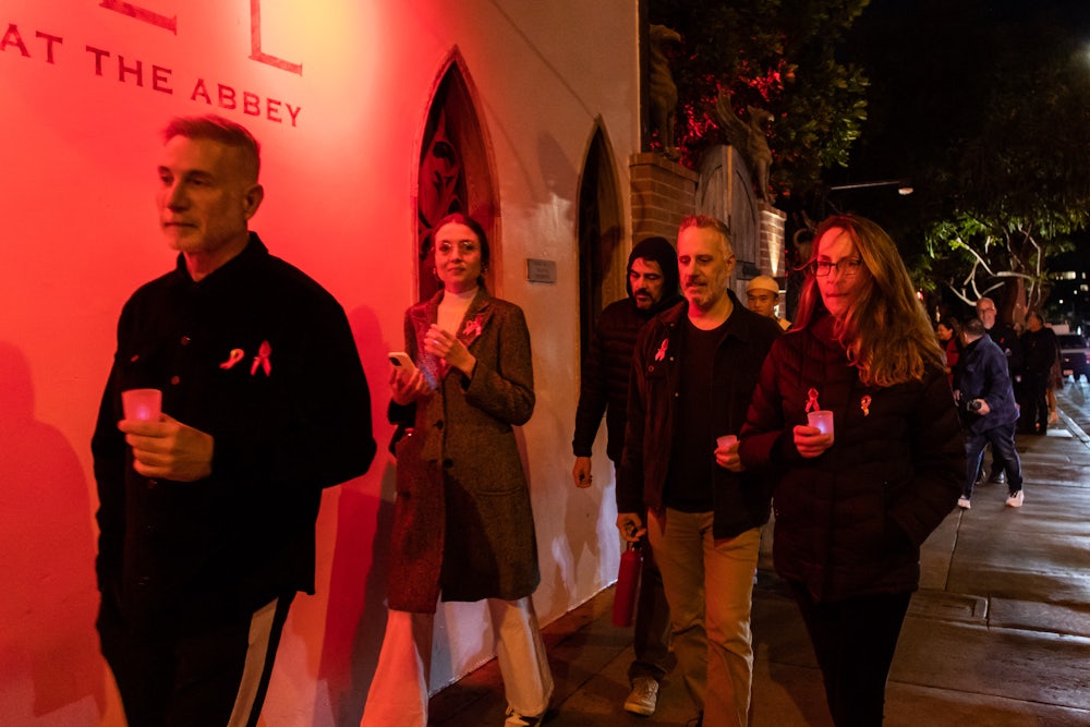 People attend the 14th Annual World AIDS Day candlelight procession in West Hollywood, California.