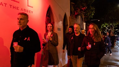 People attend the 14th Annual World AIDS Day candlelight procession in West Hollywood, California.