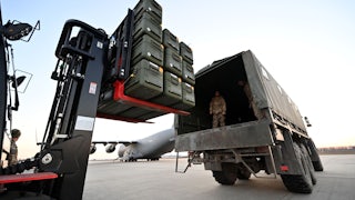 Ukrainian soldiers load U.S.-made Stinger missiles onto a truck at Boryspil Airport in Kyiv