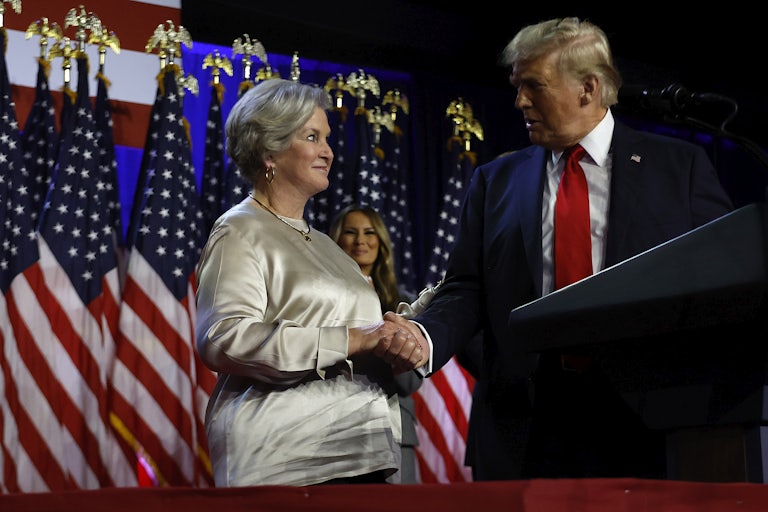 Trump shakes Susie Wiles’s hand on a campaign stage