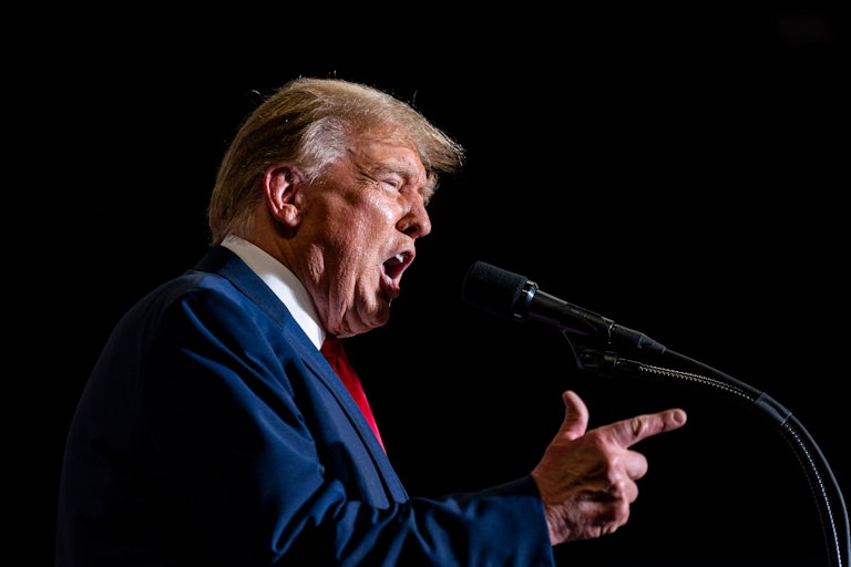 Donald Trump yells at a mic