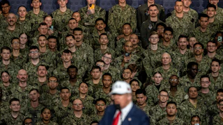 Trump speaks on the USS Washington.