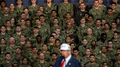 Trump speaks on the USS Washington.
