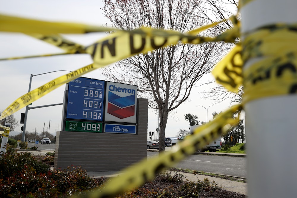Gas prices over $4.00 a gallon are displayed at a Chevron gas station.