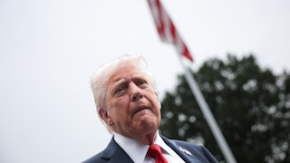 Donald Trump speaks to the media as he departs the White House.