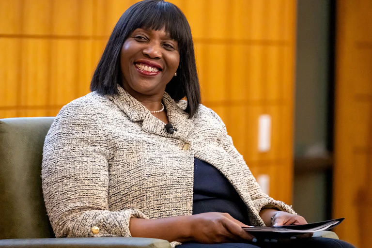 Lisa Cook, governor of the U.S. Federal Reserve, smiles at a panel