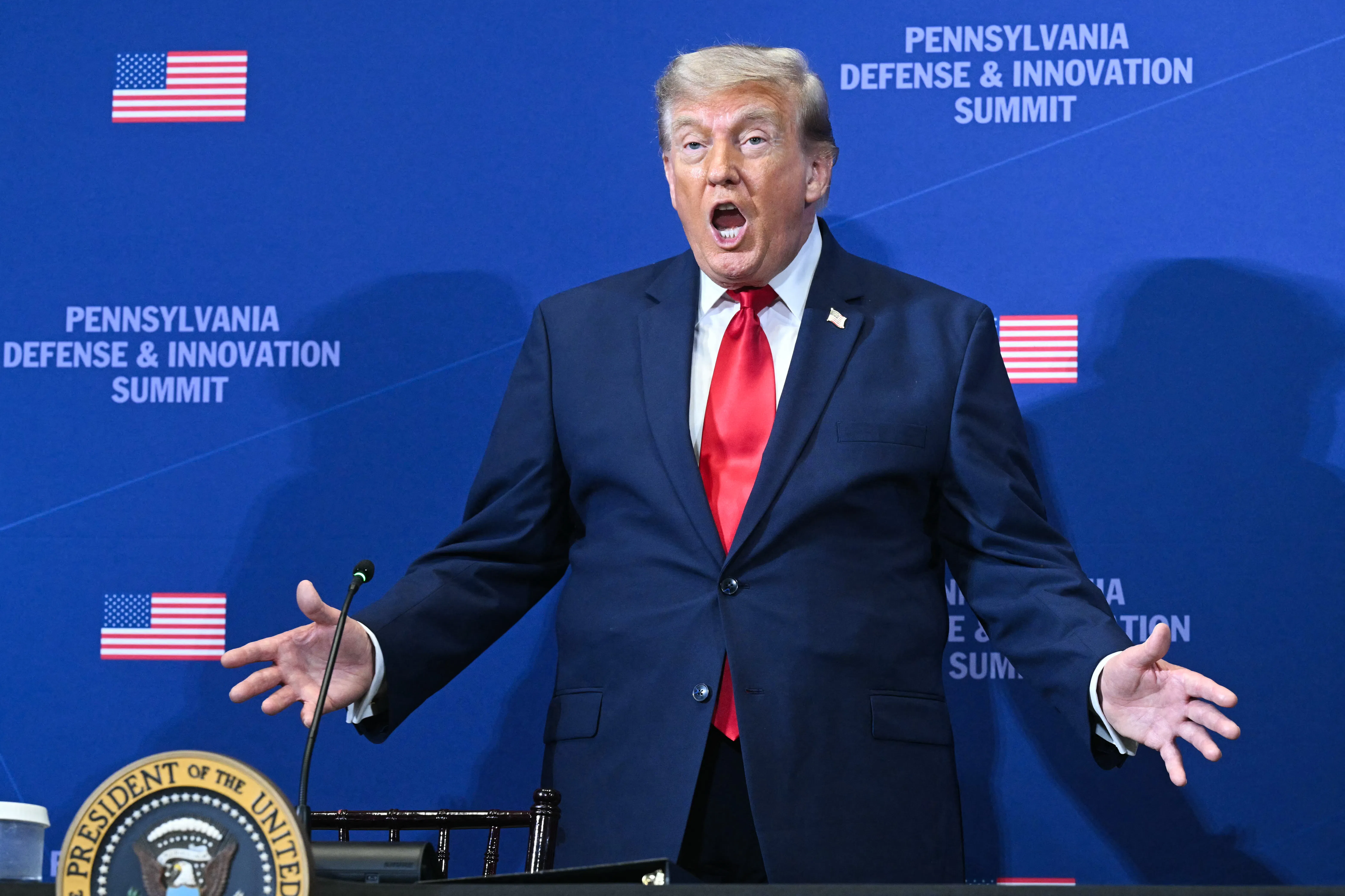 Donald Trump gestures as he arrives to speak at the Pennsylvania Defense and Innovation Summit.